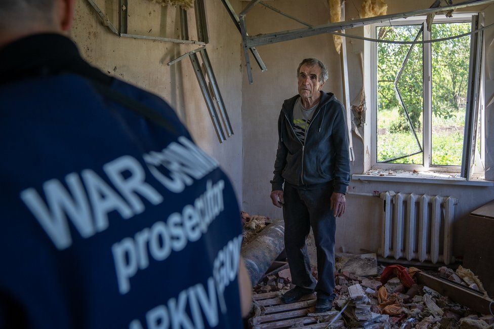 Vadym Bobaryntsev in his home in Mala Rohan, after it was destroyed by a shell in the middle of March