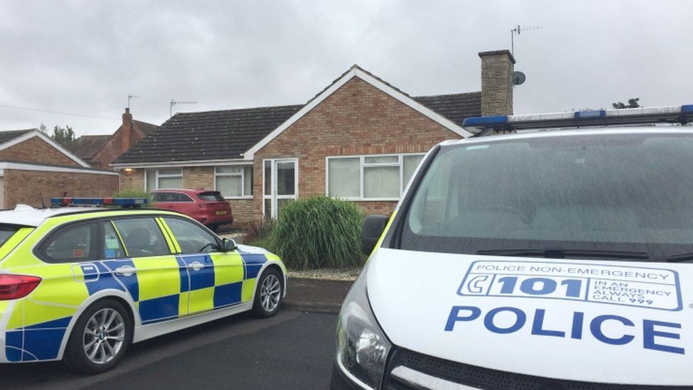 Police officers searching a house in Kempsey, Worcestershire after female human remains were found in a septic tank on July 12.