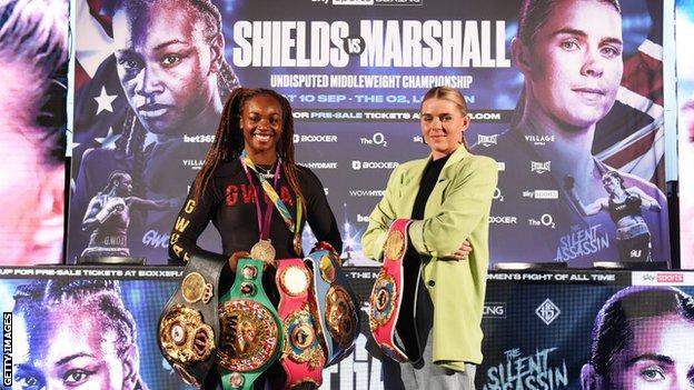 Claressa Shields and Savannah Marshall pose with their belts