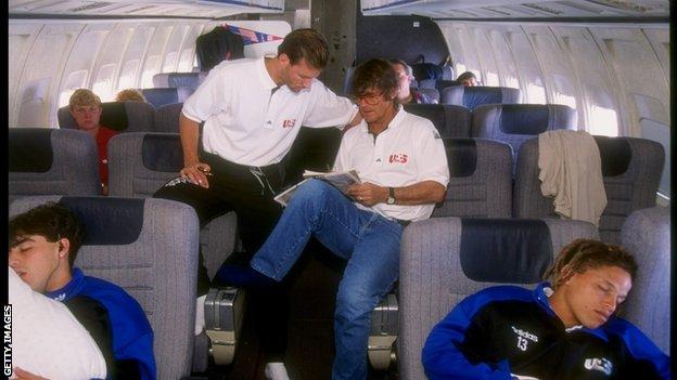 Bora Milutinovic and Eric Wynalda pictured as the US team travel to a friendly match by plane