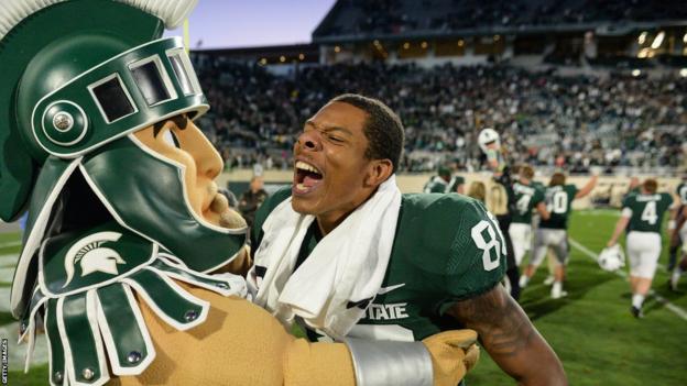 Spartans wide receiver Trishton Jackson celebrates with mascot Sparty after a Big Ten Conference NCAA football game between Michigan State and Notre Dame on September 23, 2017