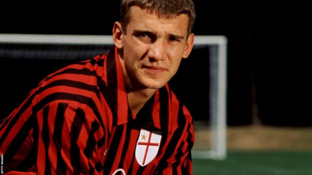 Andriy Shevchenko poses in AC Milan kit after signing for the Italian club