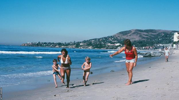 Fatima Whitbread trains on a beach with her mother and two young brothers