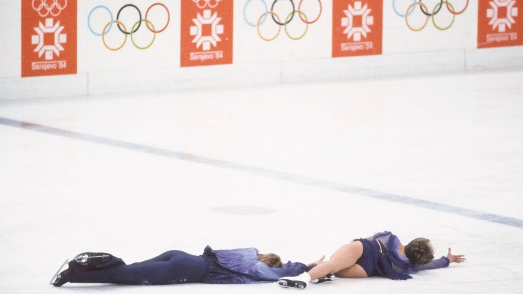 Torvill and Dean lie on the ice at the end of their Bolero routine in 1984