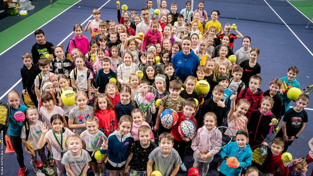 Elina Svitolina poses with children who attended a recent camp with her foundation
