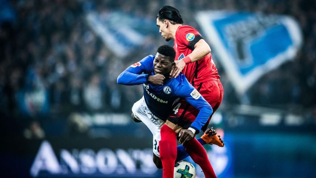 Breel Embolo is fouled while playing for Schalke against Hertha Berlin