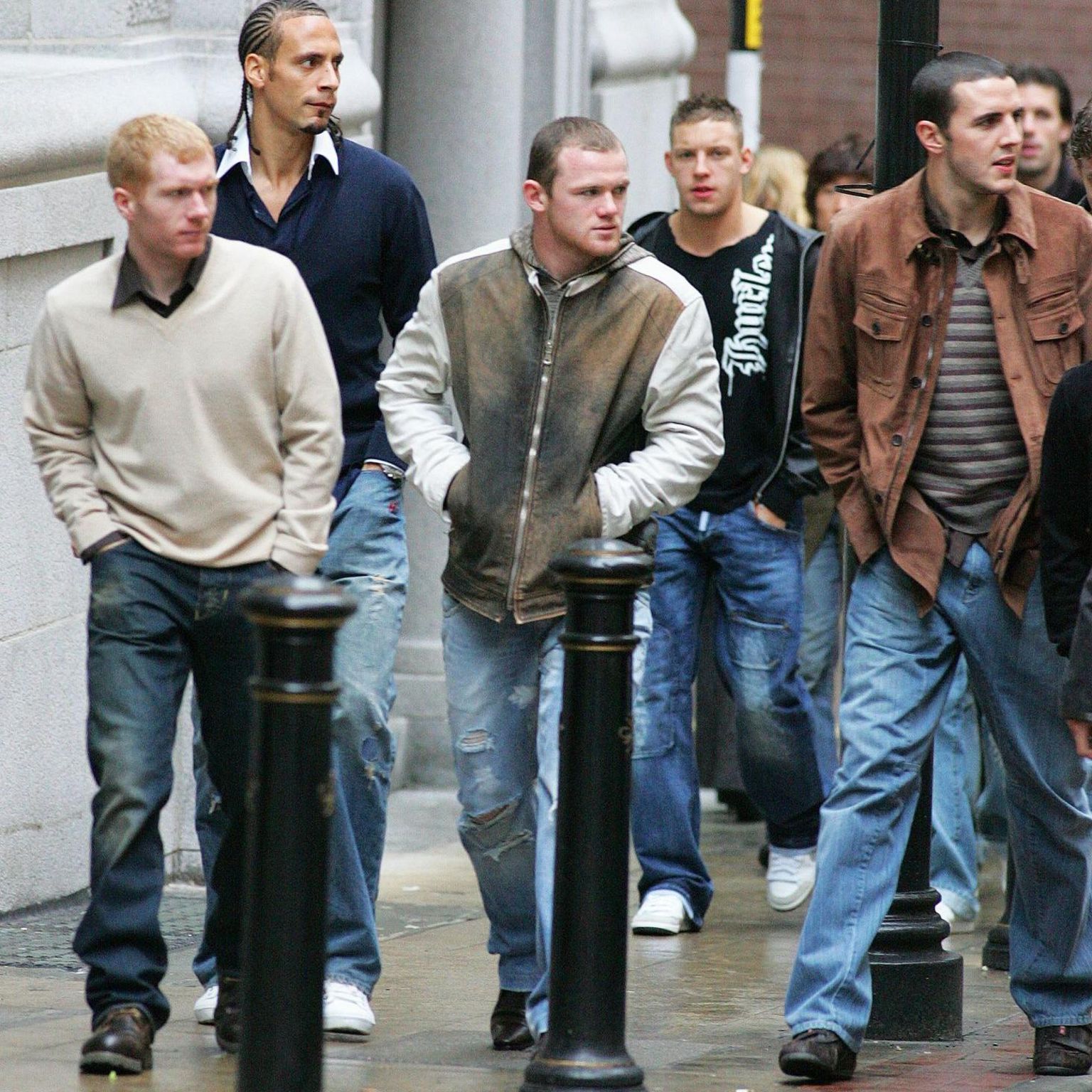 Paul Scholes, Wayne Rooney, John O'Shea and Alan Smith walk through Manchester
