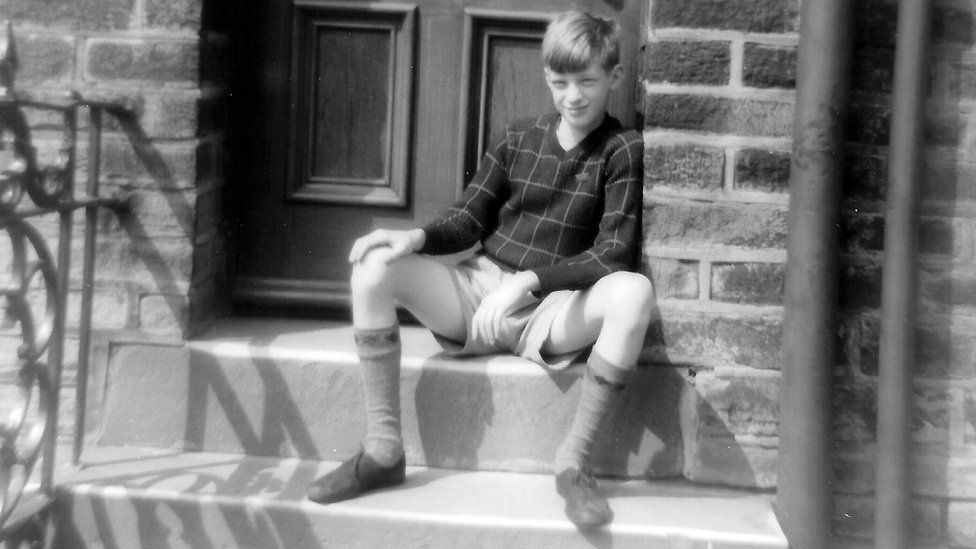 Steve Ellis on the steps of his childhood home