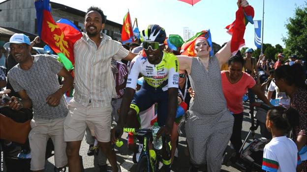 Biniam Girmay celebrates his stage win at the Tour de Suisse with fellow Eritreans
