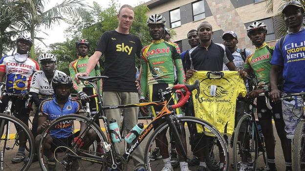 Chirs Froome (centre black Team Sky t-shirt) poses with his childhood coach David Kinja (immediate right of Froome) and members of his former Nairobi cycling club The Safari Simbaz during a visit to the city in 2013