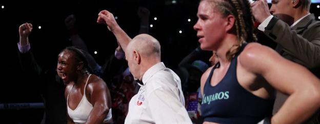 Claressa Shields celebrates while Savannah Marshall looks dispirited after their 2022 fight in London